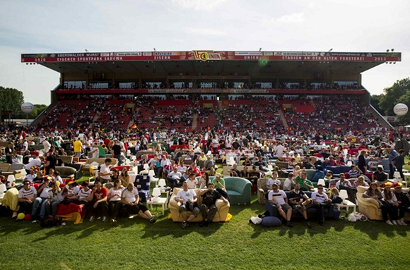 People watch Germany playing against Portugal in a World Cup soccer match during a public viewing event at the Alte Foersterei stadium in Berlin