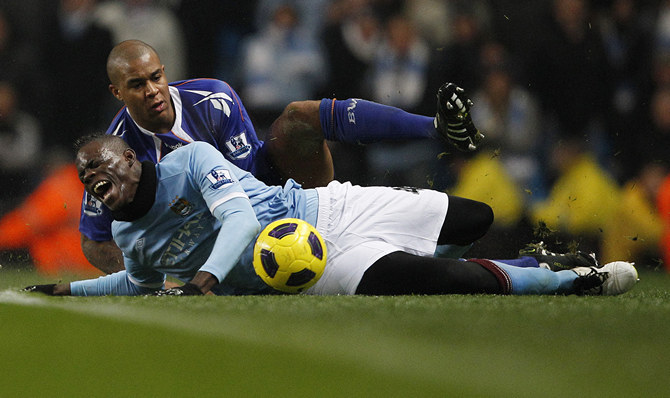 Bolton Wanderers' Knight fouls Manchester City's Balotelli during their English Premier League soccer match in Manchester