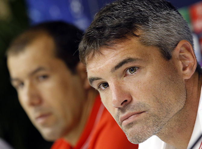 Monaco's coach Leonardo Jardim and Monaco's captain Jeremy Toulalan attend a news conference on the eve of their Champions League match against Bayer Leverkusen at Louis II stadium in Monaco