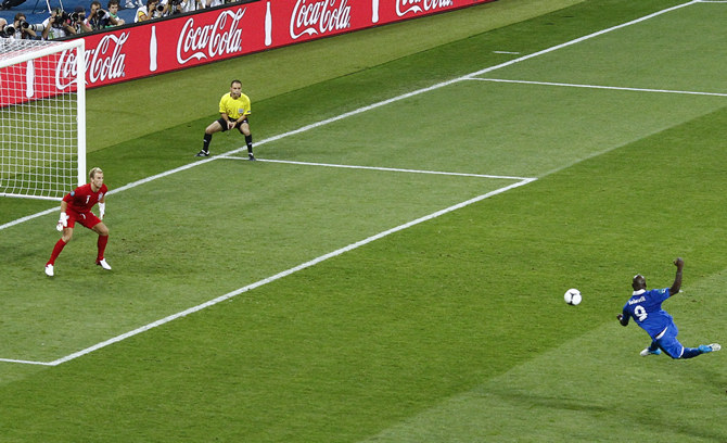 Italy's Balotelli tries to score against England's Hart during their Euro 2012 quarter-final soccer match at the Olympic stadium in Kiev