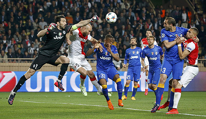 Juventus goalkeeper Buffon and his team mate Evra challenge Monaco's Abdennour during their quarter-final second leg Champions League soccer match at the Louis II stadium in Monaco