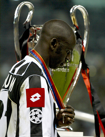 JUVENTUS' THURAM WALKS PAST THE CHAMPIONS LEAGUE TROPHY AFTER LOSING INTHE FINAL TO AC MILAN AT OLD TRAFFORD.