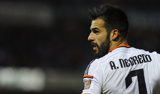 Valencia's forward Alvaro Negredo reacts during the Spanish league football match Granada CF vs Valencia CF at the Nuevo Los Carmenes stadium in Granada on December 7, 2014.   AFP PHOTO/ JORGE GUERRERO        (Photo credit should read Jorge Guerrero/AFP/Getty Images)